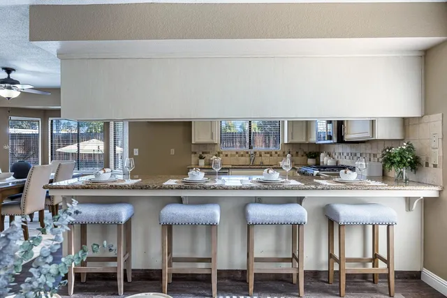 a view of a dining room with furniture window and wooden floor