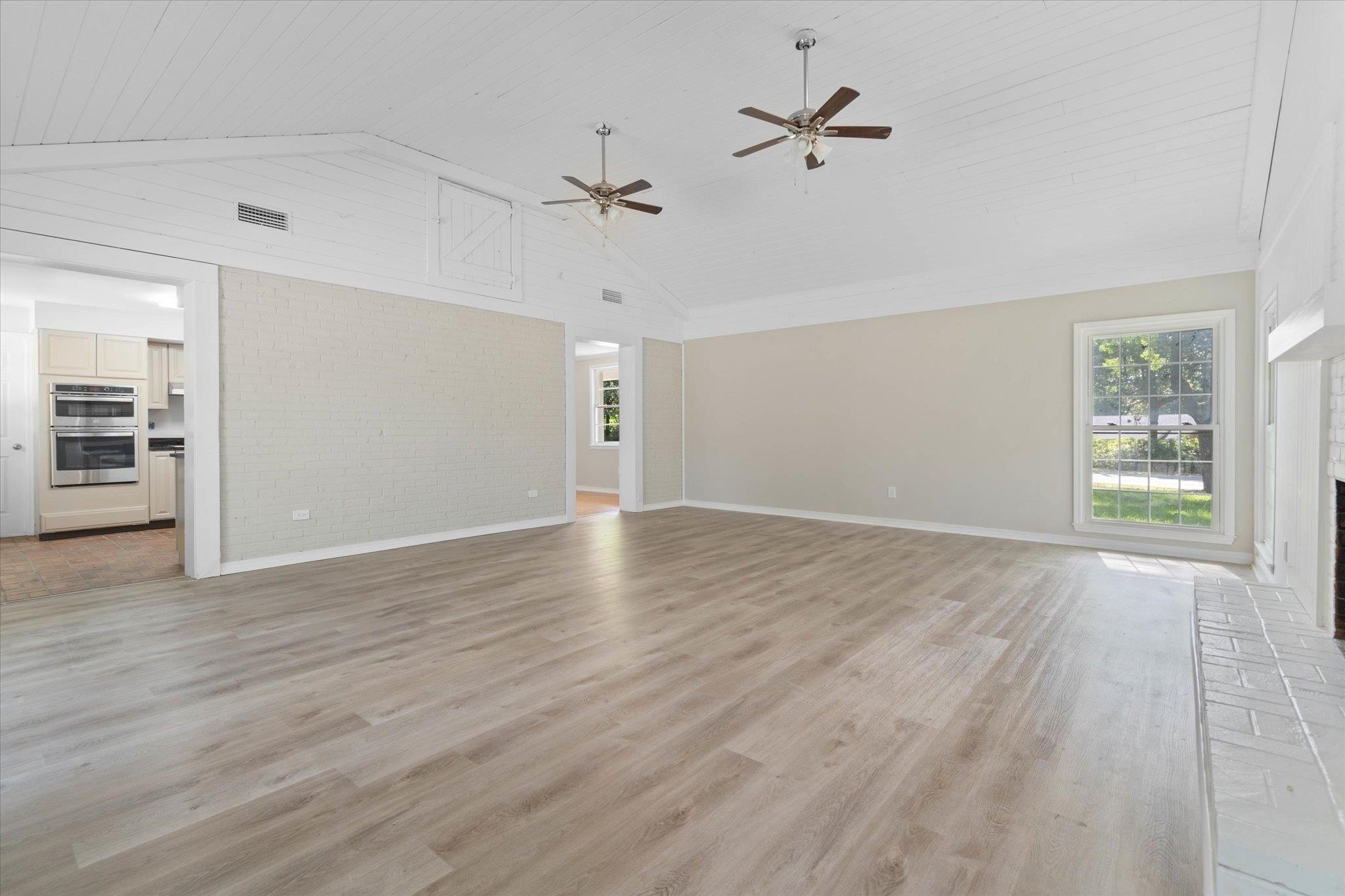 4700 Bit And Spur Road Mobile, AL 36608 - Photo 6 of 21 Unfurnished living room featuring baseboards, visible vents, and a wealth of natural light