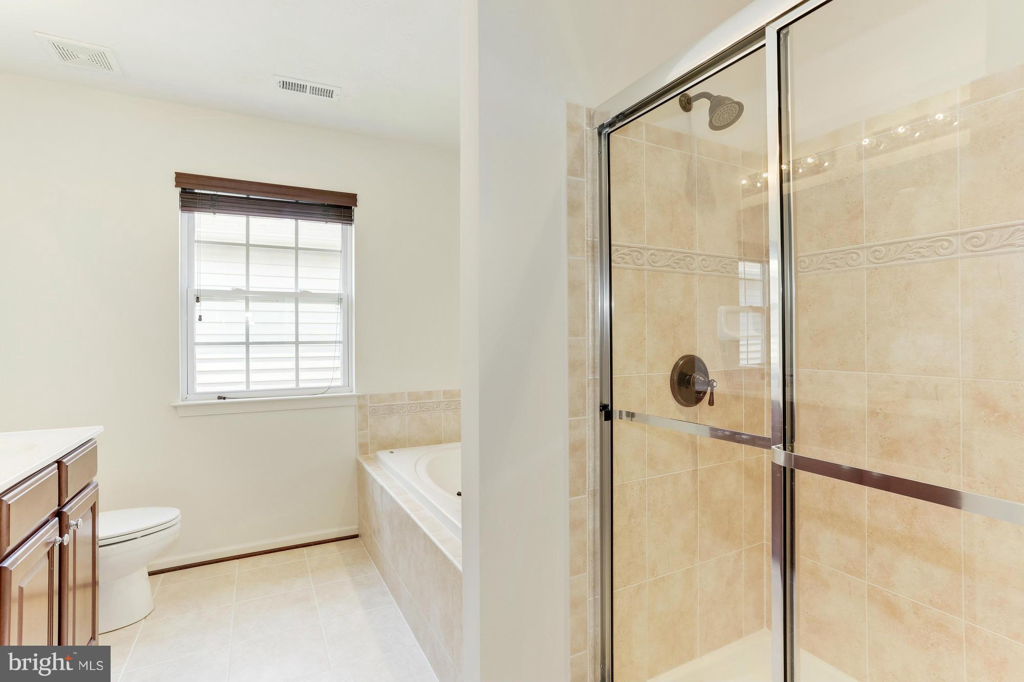 9637 Biggs Road Middle River, MD 21220 - Photo 22 of 30 a bathroom with a bathtub and shower