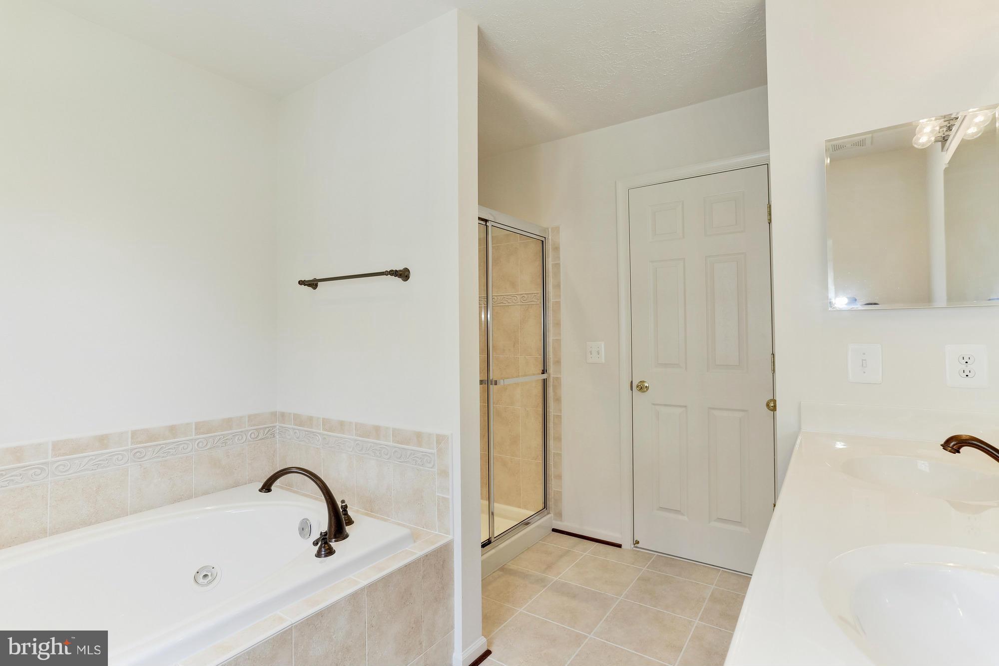 9637 Biggs Road Middle River, MD 21220 - Photo 24 of 30 a bathroom with a tub and shower