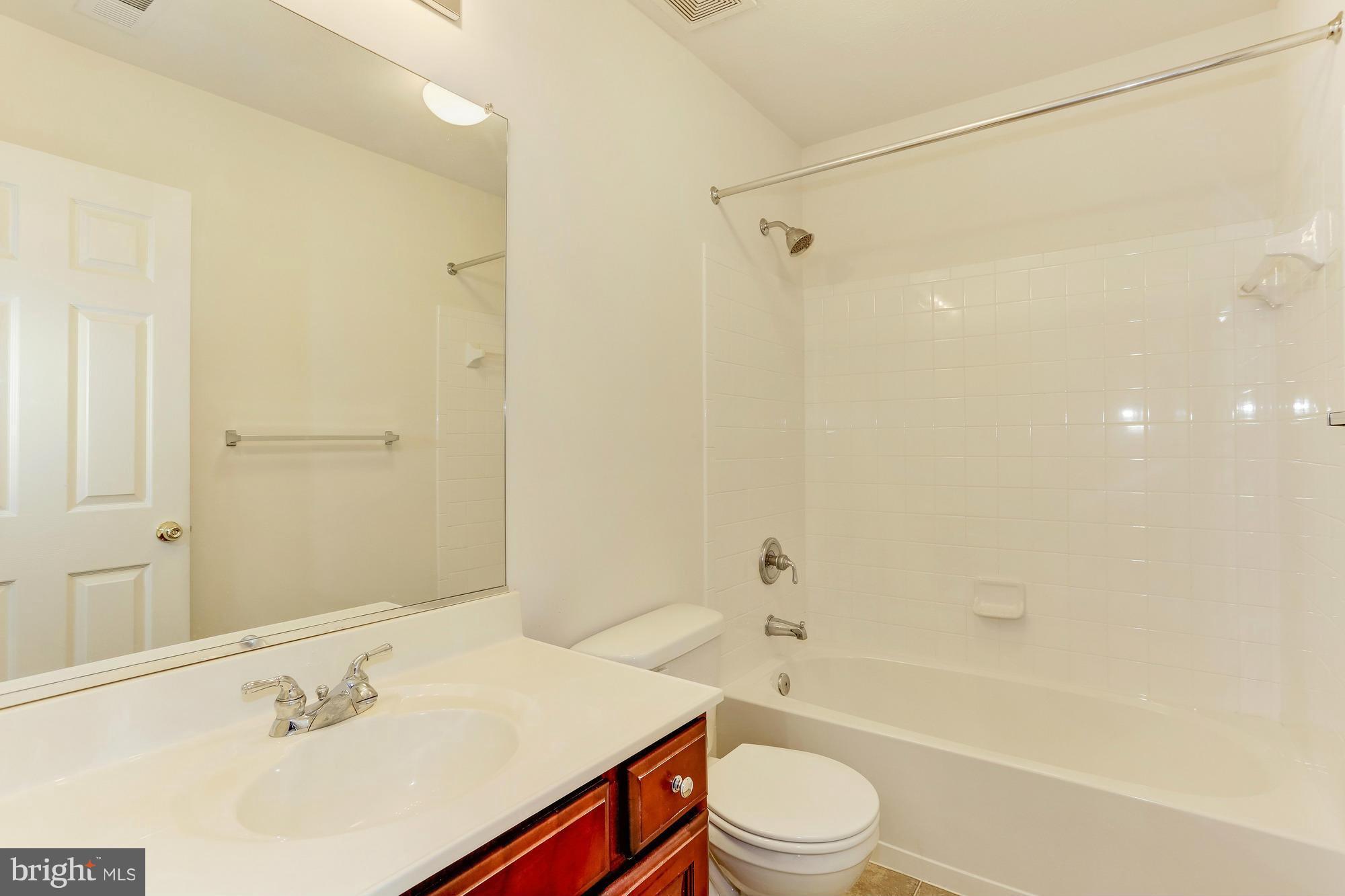 9637 Biggs Road Middle River, MD 21220 - Photo 26 of 30 a bathroom with a sink a toilet and shower