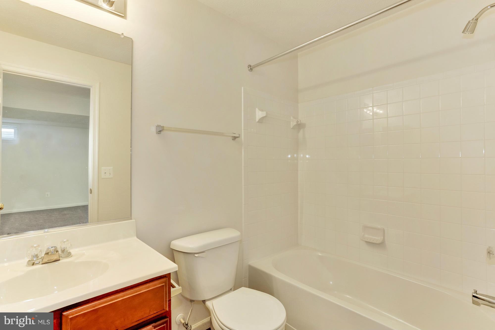9637 Biggs Road Middle River, MD 21220 - Photo 29 of 30 a bathroom with a sink toilet and shower