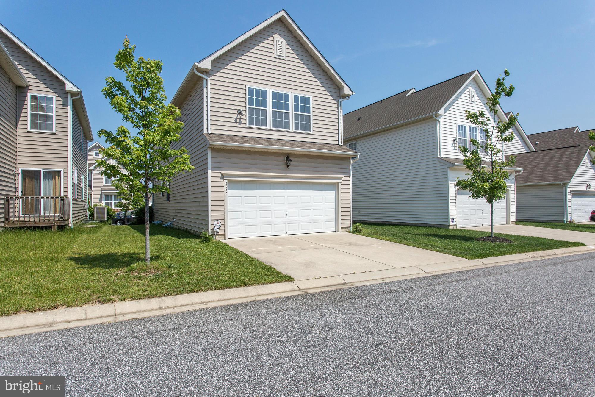 9637 Biggs Road Middle River, MD 21220 - Photo 30 of 30 a front view of a house with a yard and garage