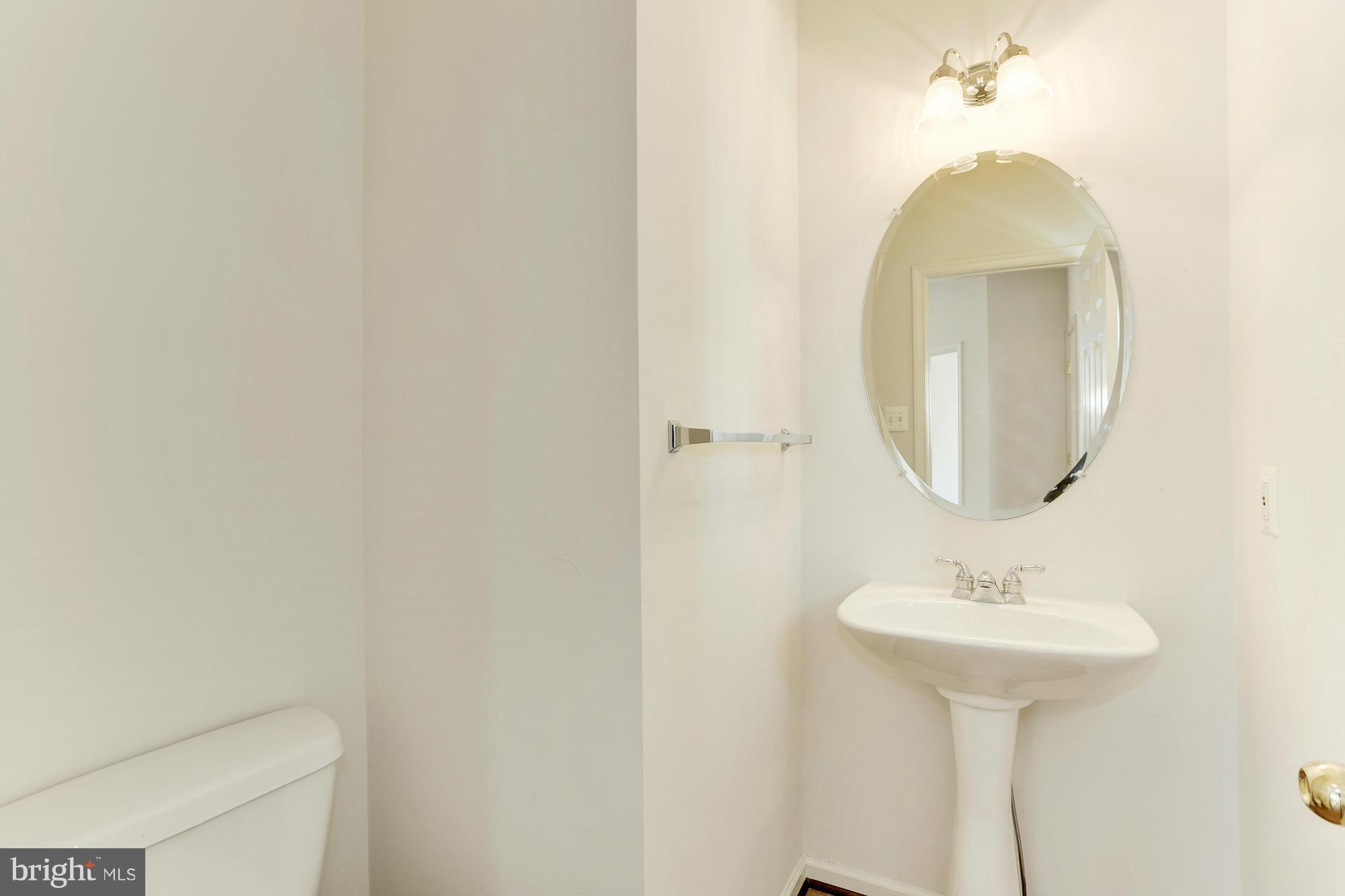 9637 Biggs Road Middle River, MD 21220 - Photo 5 of 30 a bathroom with a sink and a mirror