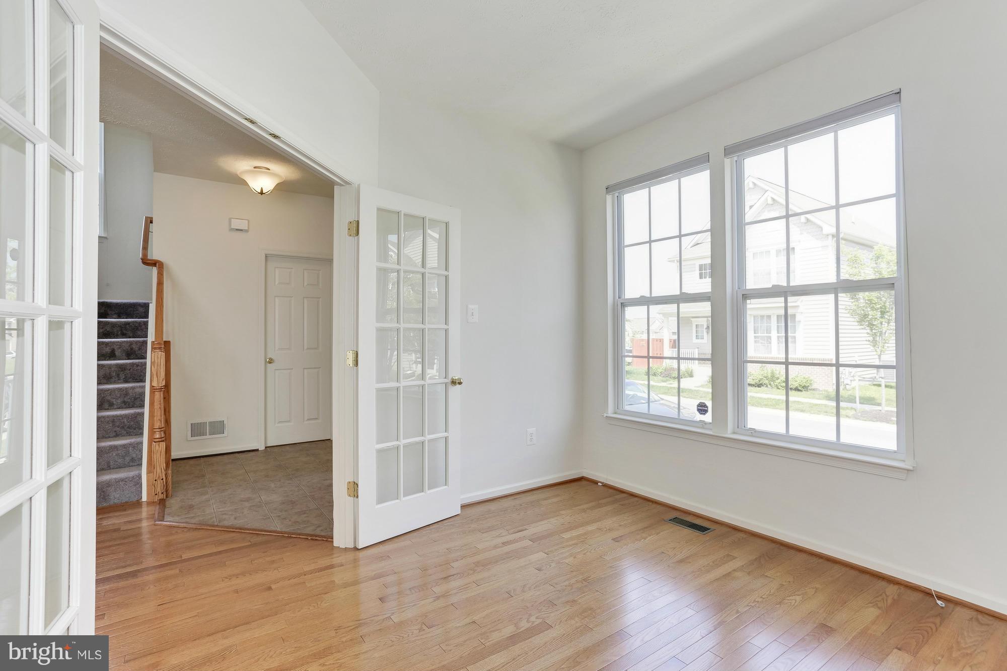 9637 Biggs Road Middle River, MD 21220 - Photo 6 of 30 an empty room with wooden floor closet and windows