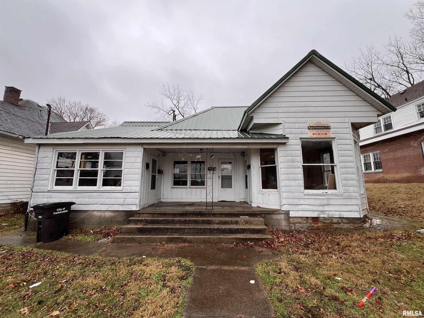 406 South University Avenue Carbondale, IL 62901 - Photo 1 of 36 a front view of a house with yard