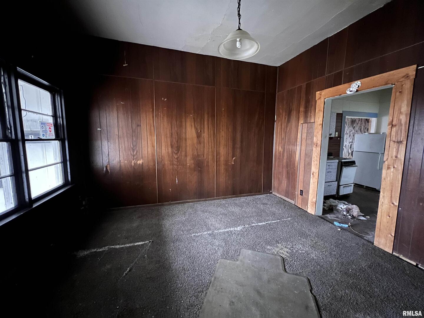 406 South University Avenue Carbondale, IL 62901 - Photo 34 of 36 a view of empty room with a ceiling fan and window