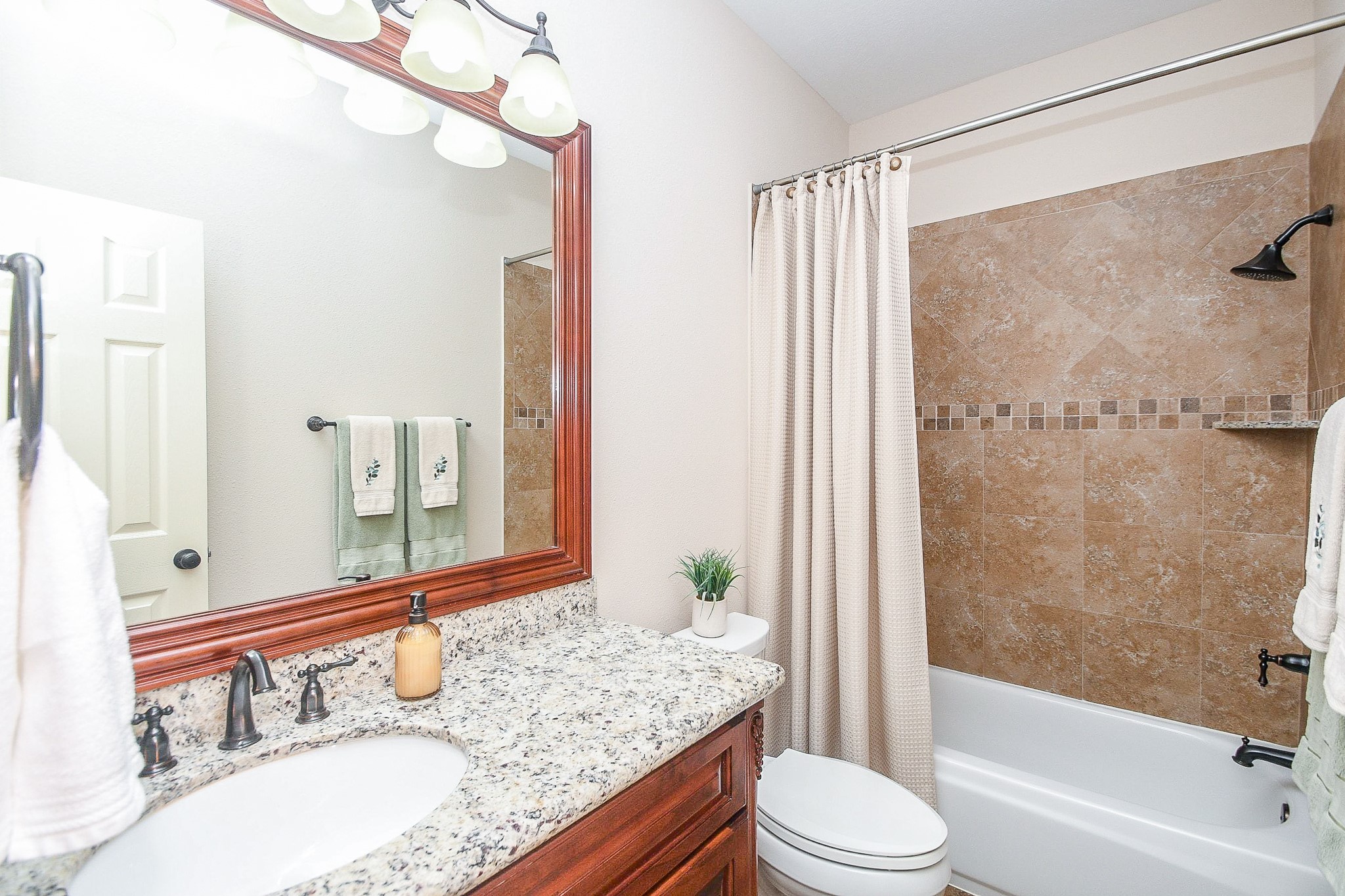 1703 Fall Ridge Circle Katy, TX 77494 - Photo 21 of 38 This secondary Full bathroom is located on the 1st floor, providing convenient access for guests or occupants of the adjacent fourth bedroom.