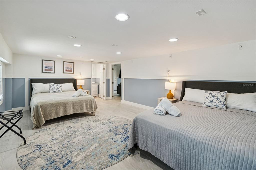 330 6th Avenue Indian Rocks Beach, FL 33785 - Photo 25 of 52 a bedroom with a bed and a couch