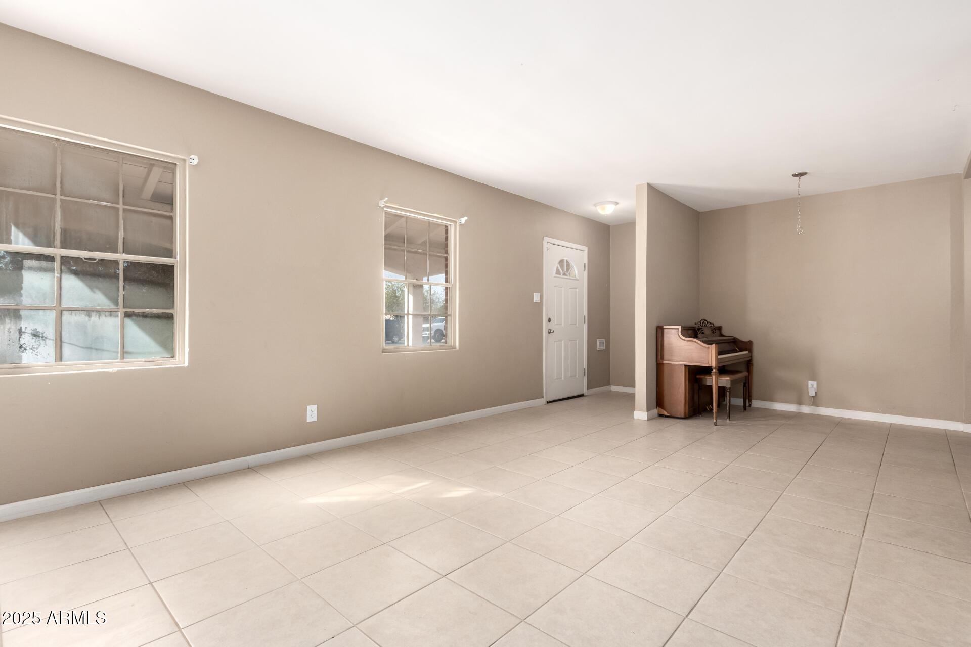 1736 East Coronado Road Phoenix, AZ 85006 - Photo 3 of 28 a view of an empty room with a window
