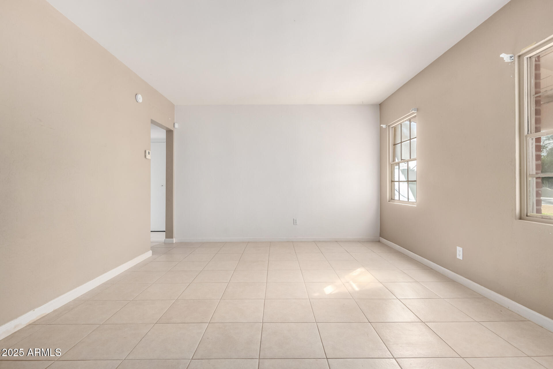 1736 East Coronado Road Phoenix, AZ 85006 - Photo 4 of 28 a view of an empty room with a window