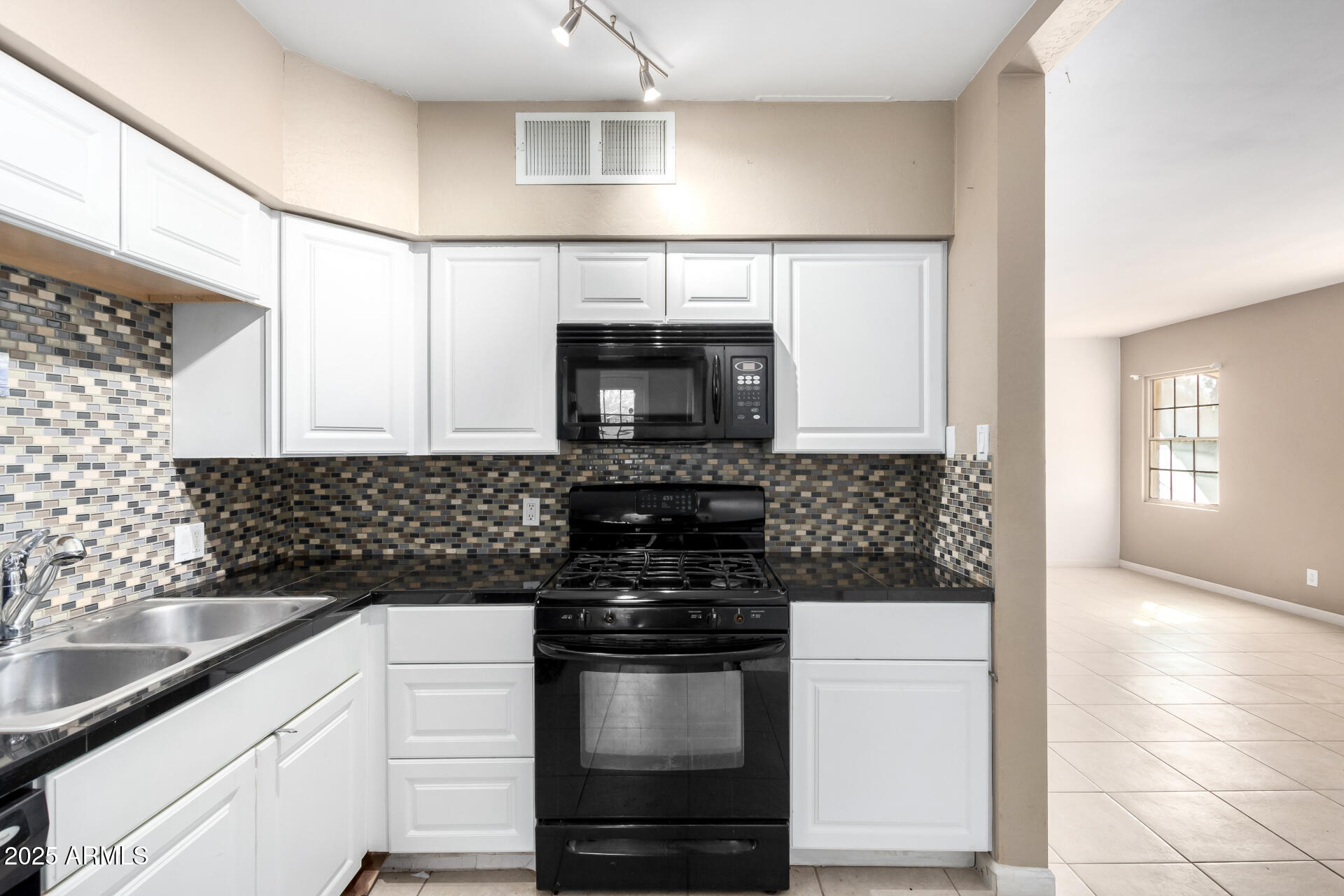 1736 East Coronado Road Phoenix, AZ 85006 - Photo 7 of 28 a kitchen with stainless steel appliances granite countertop a stove and a sink