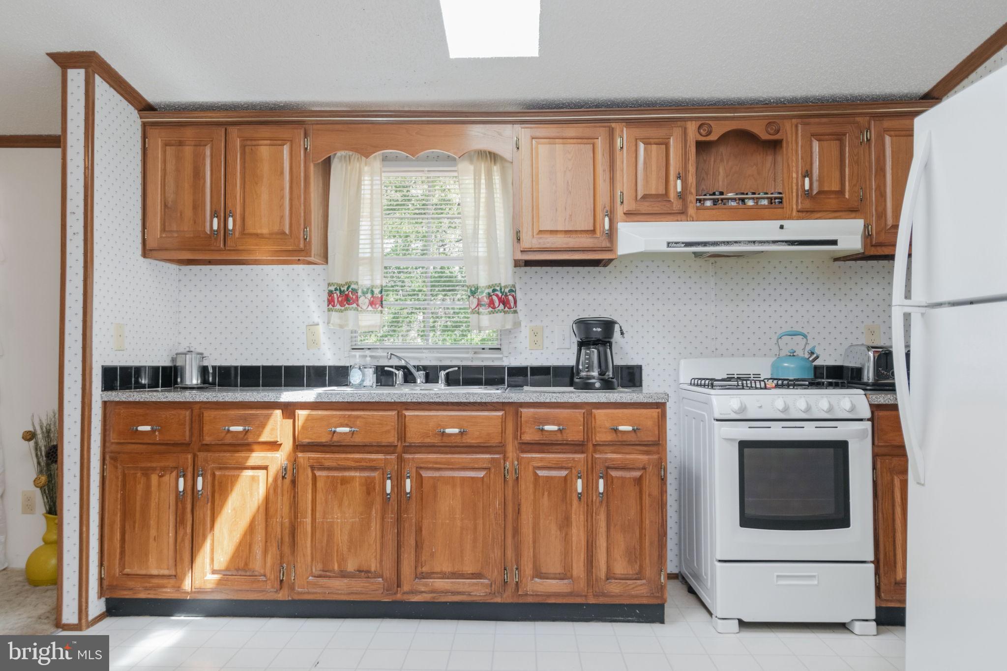 19341 Lahore Road Orange, VA 22960 - Photo 17 of 39 a kitchen with stainless steel appliances granite countertop a stove and cabinets