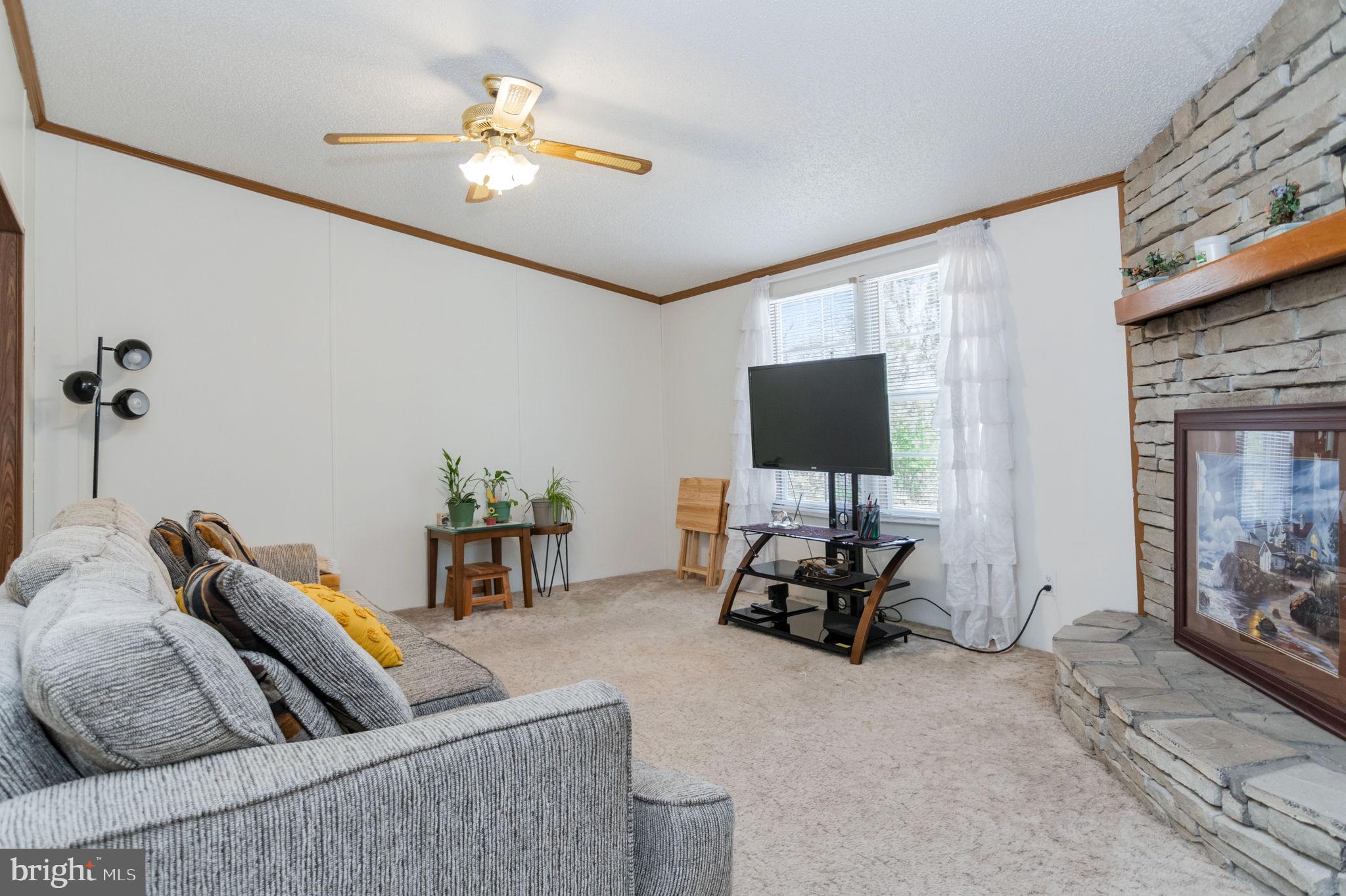 19341 Lahore Road Orange, VA 22960 - Photo 18 of 39 a living room with furniture and a flat screen tv