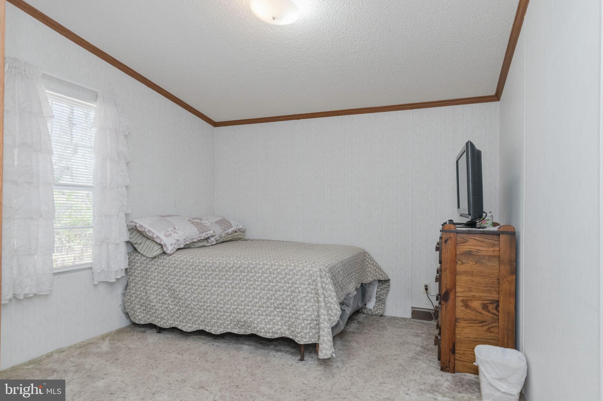 19341 Lahore Road Orange, VA 22960 - Photo 22 of 39 a bedroom with a bed and wooden floor