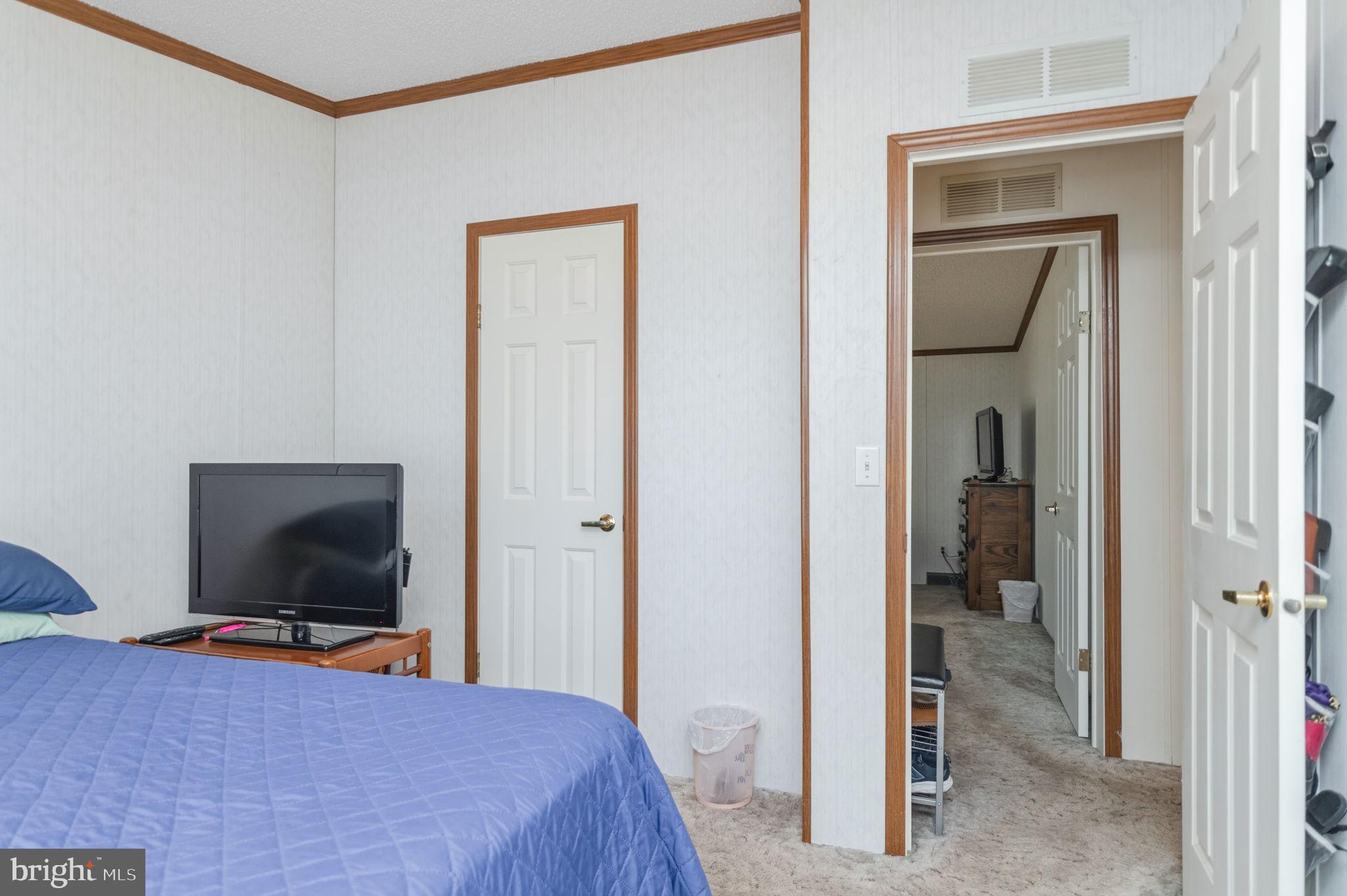 19341 Lahore Road Orange, VA 22960 - Photo 30 of 39 a bedroom with a bed and a flat screen tv