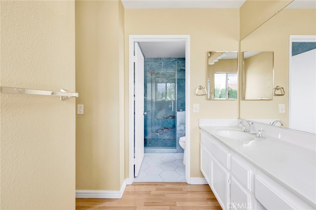 970 West Norwood Street Rialto, CA 92377 - Photo 11 of 17 a bathroom with a sink and a mirror