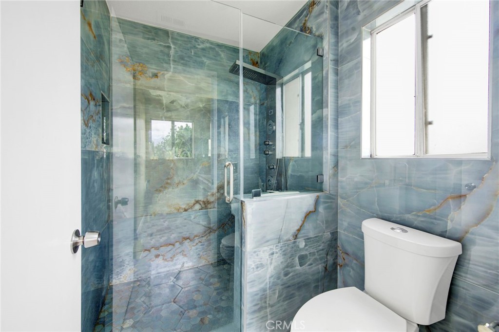 970 West Norwood Street Rialto, CA 92377 - Photo 12 of 17 a white toilet sitting next to a bathroom sink