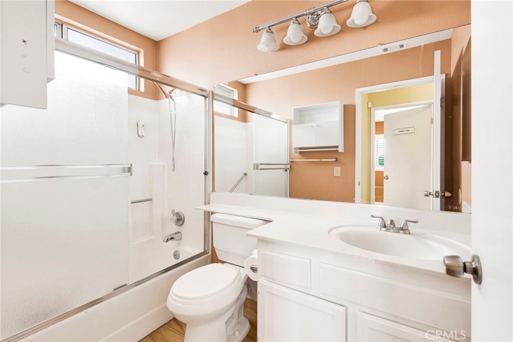 970 West Norwood Street Rialto, CA 92377 - Photo 14 of 17 a bathroom with a sink a toilet and shower