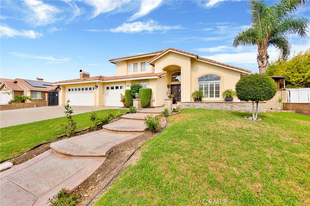 970 West Norwood Street Rialto, CA 92377 - Photo 2 of 17 a front view of house with yard and green space