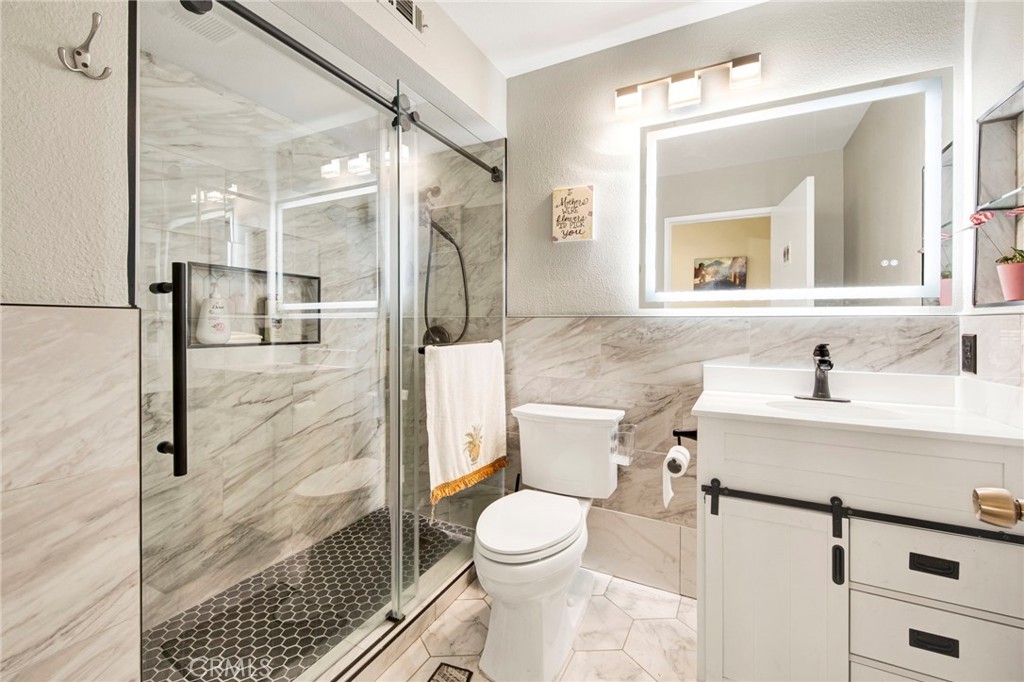 970 West Norwood Street Rialto, CA 92377 - Photo 8 of 17 a bathroom with a sink toilet and shower