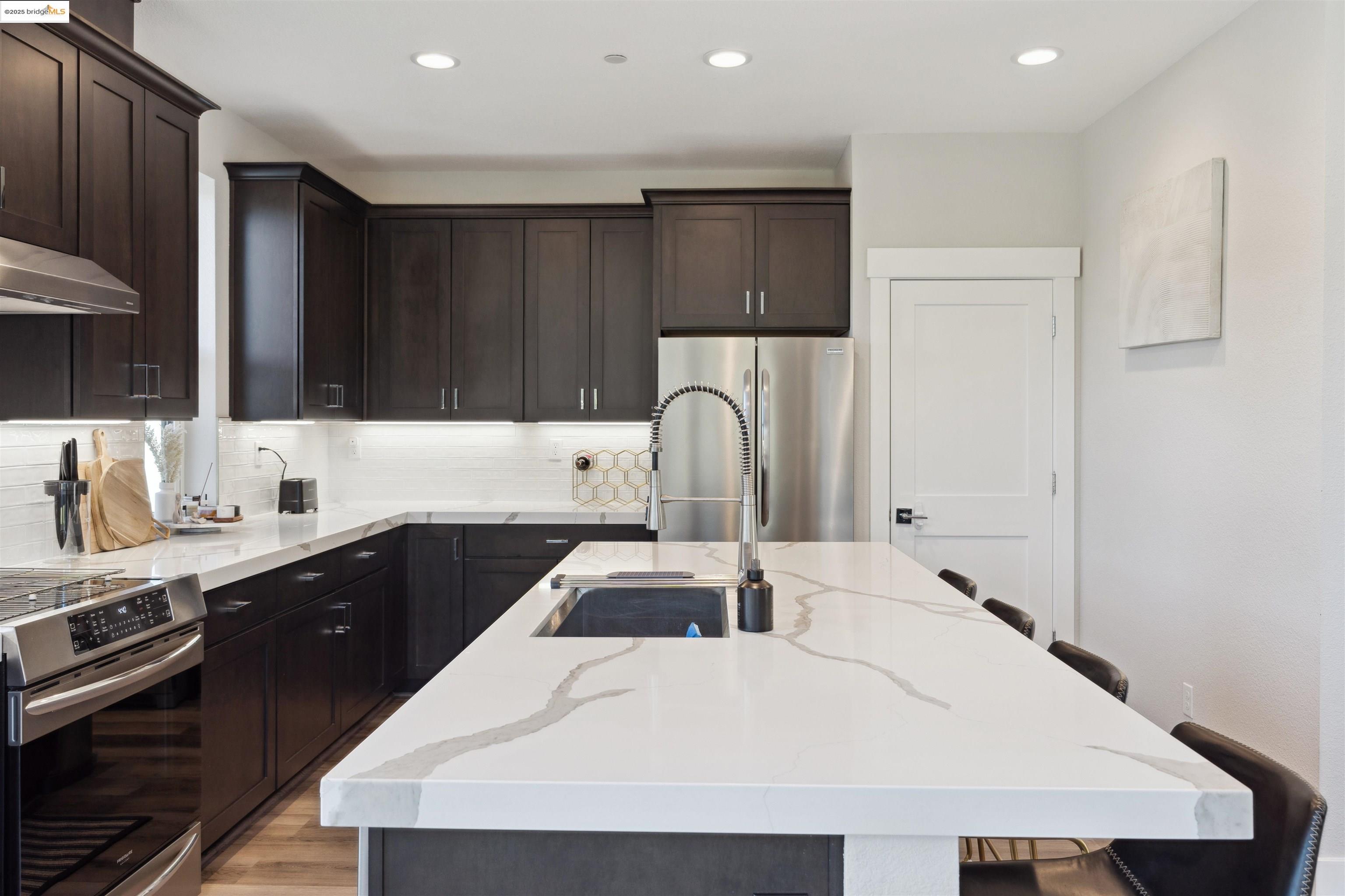 2640 Jones Road, Unit A Walnut Creek, CA 94597 - Photo 16 of 43 a kitchen with granite countertop a sink a stove and refrigerator
