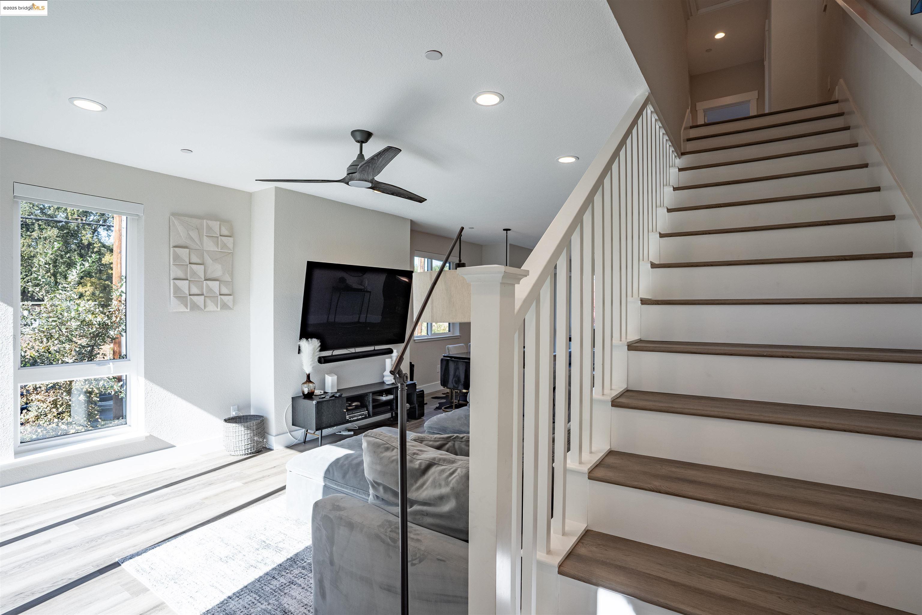 2640 Jones Road, Unit A Walnut Creek, CA 94597 - Photo 26 of 43 Stairway with a ceiling fan, recessed lighting, healthy amount of natural light, and wood finished floors
