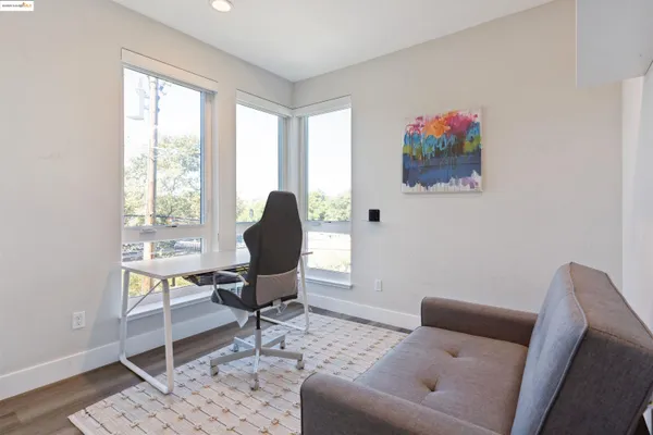 a work room with furniture and a window