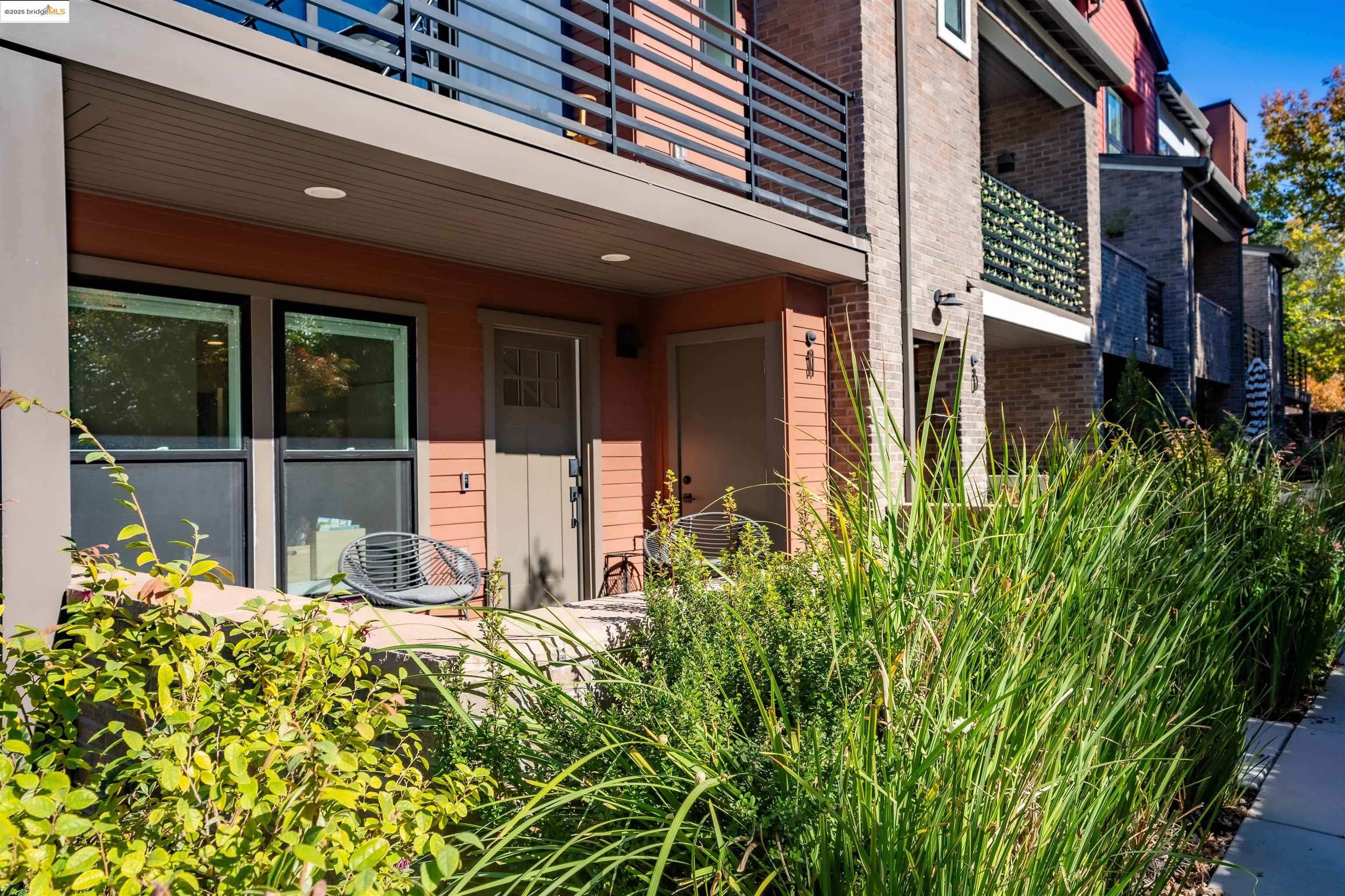 2640 Jones Road, Unit A Walnut Creek, CA 94597 - Photo 4 of 43 front view of a house with a large window and potted plants