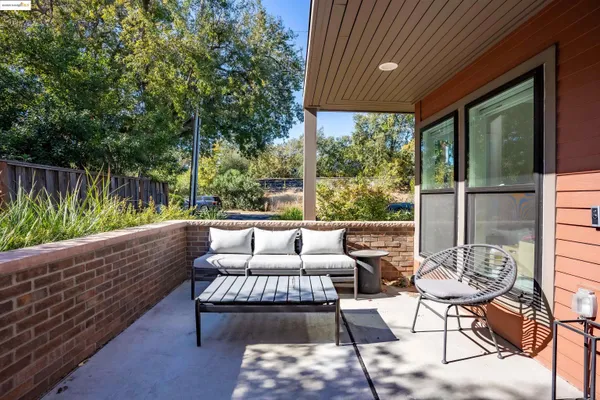 a outdoor living space with furniture and garden view