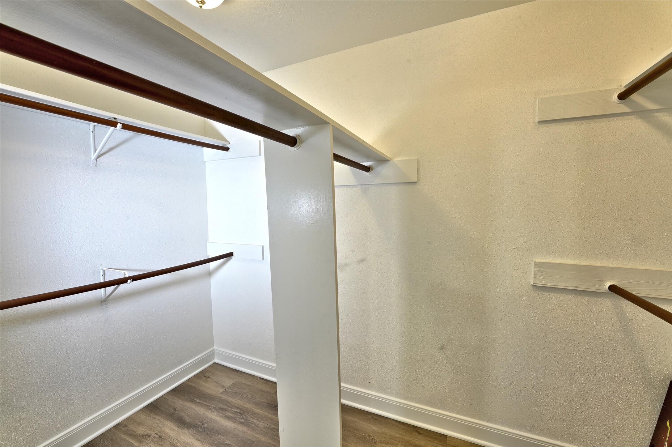 16715 Maplemont Drive Houston, TX 77095 - Photo 13 of 24 Spacious primary bedroom walk-in closet it offers ample storage and a clean, organized look.