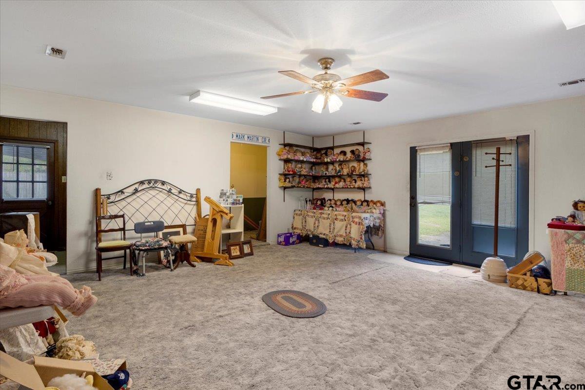 1302 Jeb Stuart Drive Tyler, TX 75703 - Photo 36 of 47 a view of a livingroom with furniture and a ceiling fan