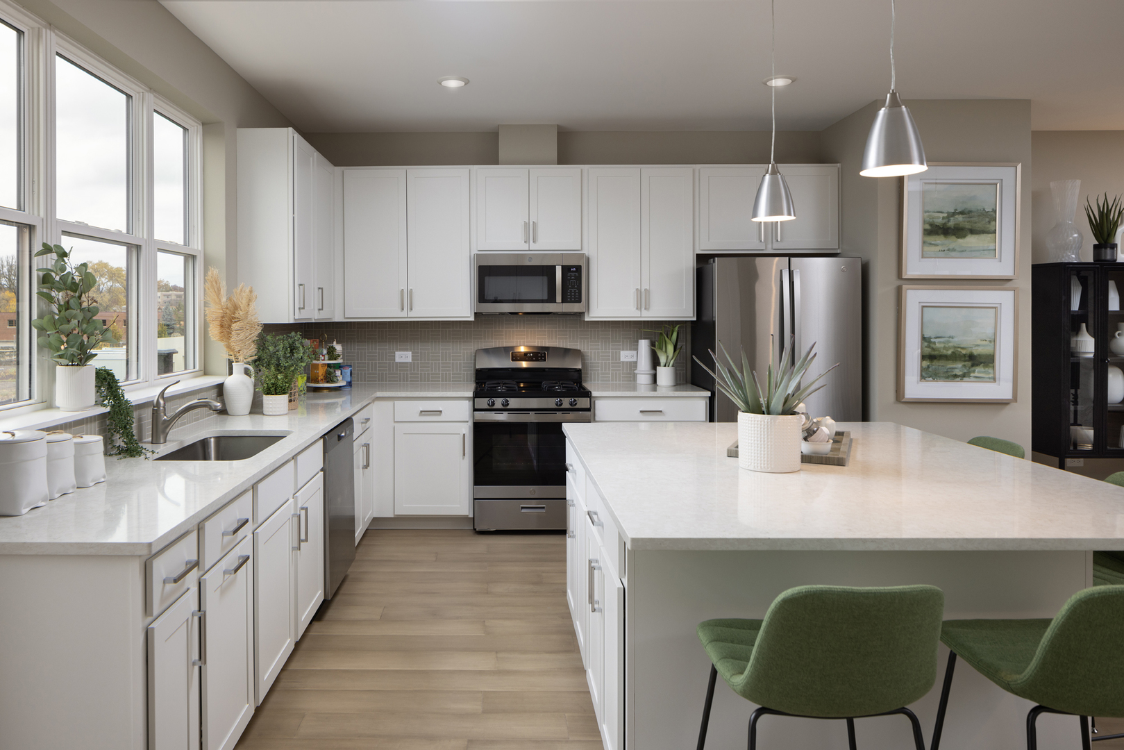 1179 Shermer Road Northbrook, IL 60062 - Photo 7 of 10 a kitchen with stainless steel appliances a stove a sink a refrigerator a center island and a window