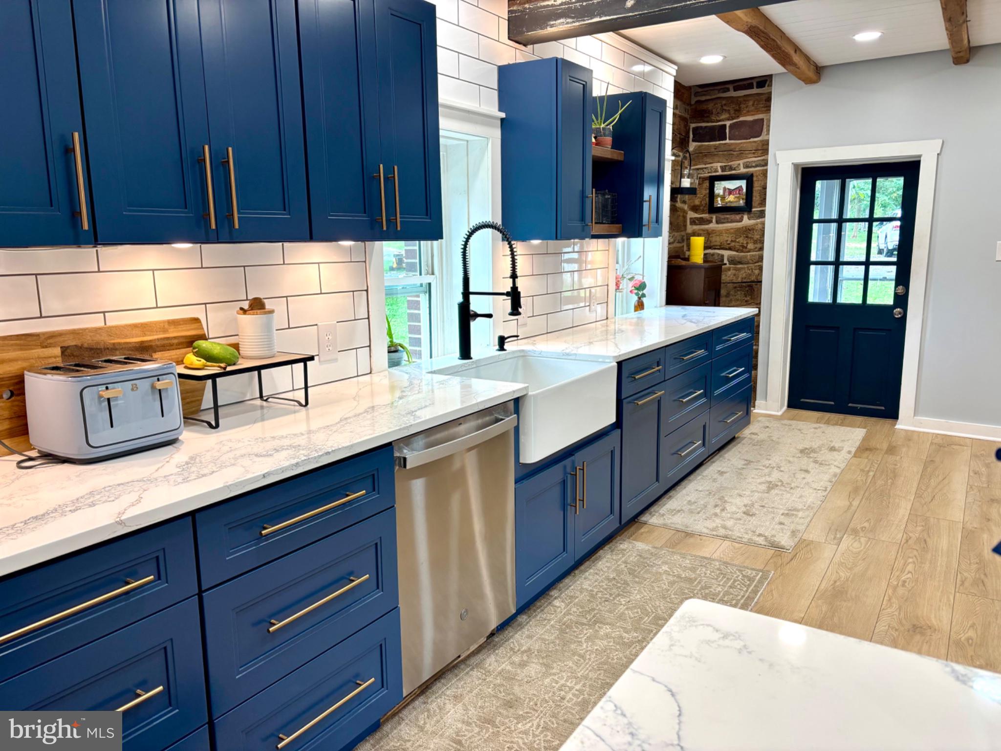 1385 County Line Road Quakertown, PA 18951 - Photo 14 of 21 Chic blue kitchen with modern flair.