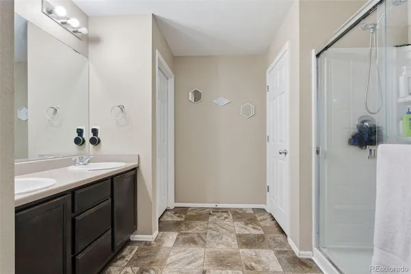 a bathroom with a sink and mirror