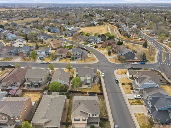 an aerial view of residential houses with outdoor space