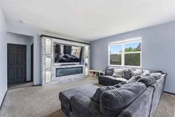 a living room with furniture and a window