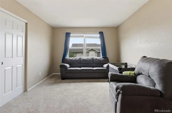 a living room with a couch and a window