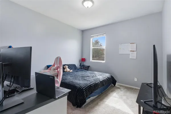 a bed room with a bed and a window
