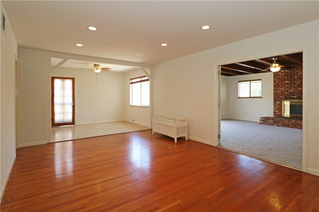 721 North Milford Road Orange, CA 92867 - Photo 9 of 38 Family room with wood flooring and a dining area near the kitchen.