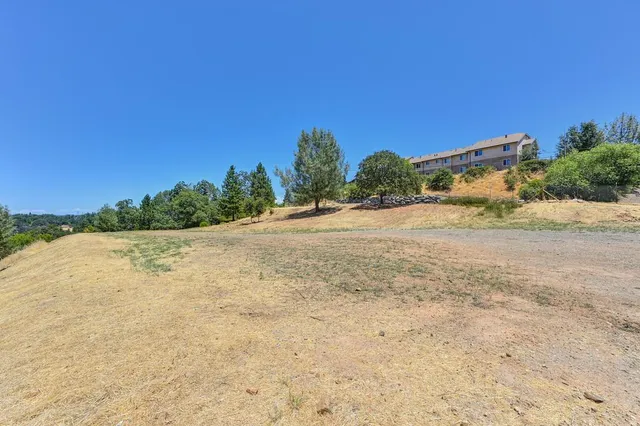 a view of a road with a building in the background