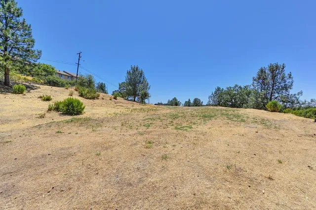 a view of a backyard of a house