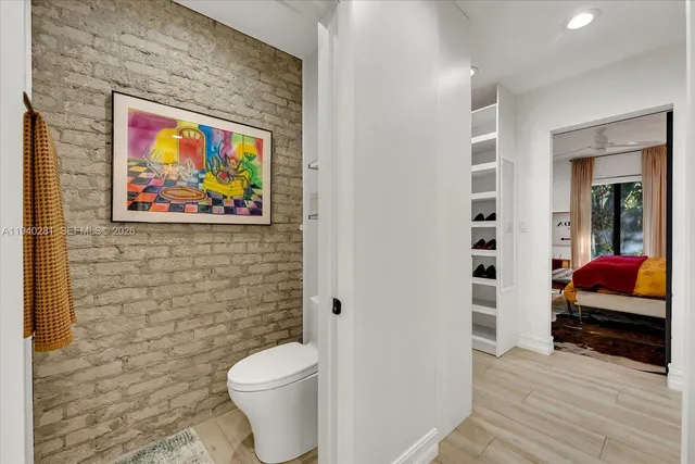 a bathroom with a toilet a sink and a shower