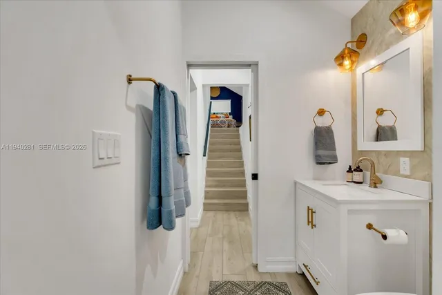a bathroom with a sink and mirror