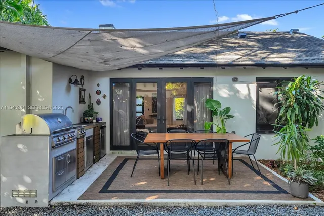 a dining room with a table and chairs