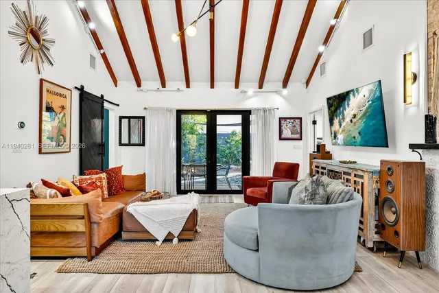 a living room with furniture fireplace and flat screen tv