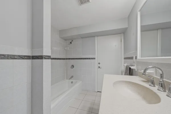 a bathroom with a sink and a bathtub