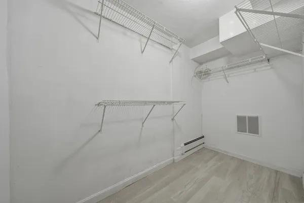 a view of a room with racks on the wall