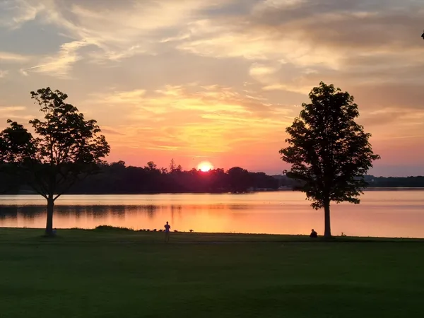 a view of lake with green space