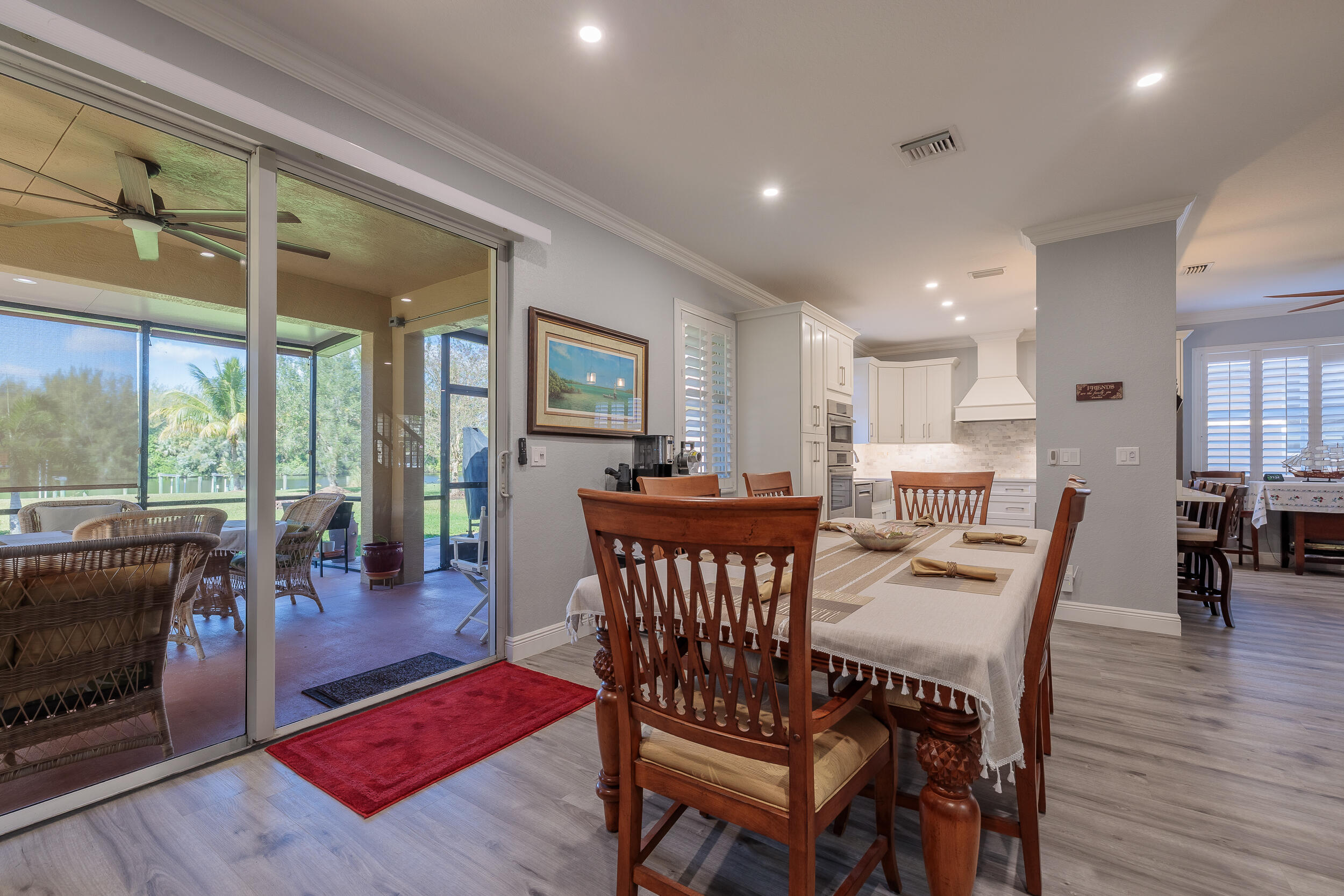 3285 Southwest Porpoise Circle Stuart, FL 34997 - Photo 19 of 69 a view of a dining room with furniture window and wooden floor
